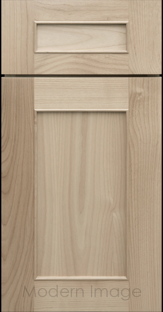 Detail view of a Chandler Shaker cabinet door in Blondie stain with raised molding along the inner panel.